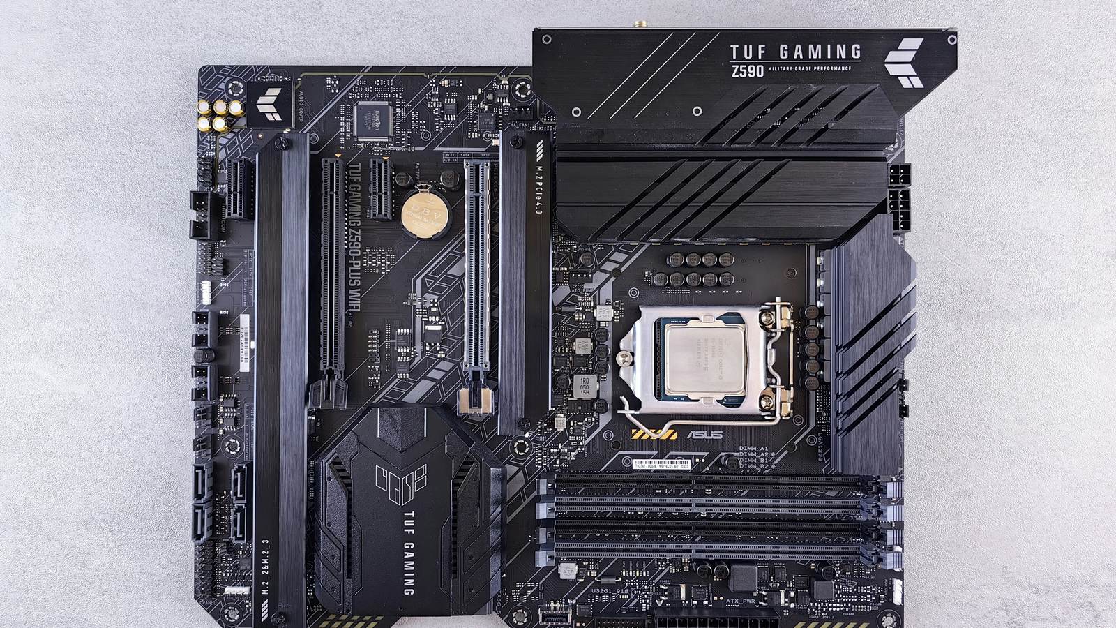 Desktop motherboard seen from above, with the processor installed and empty memory slots