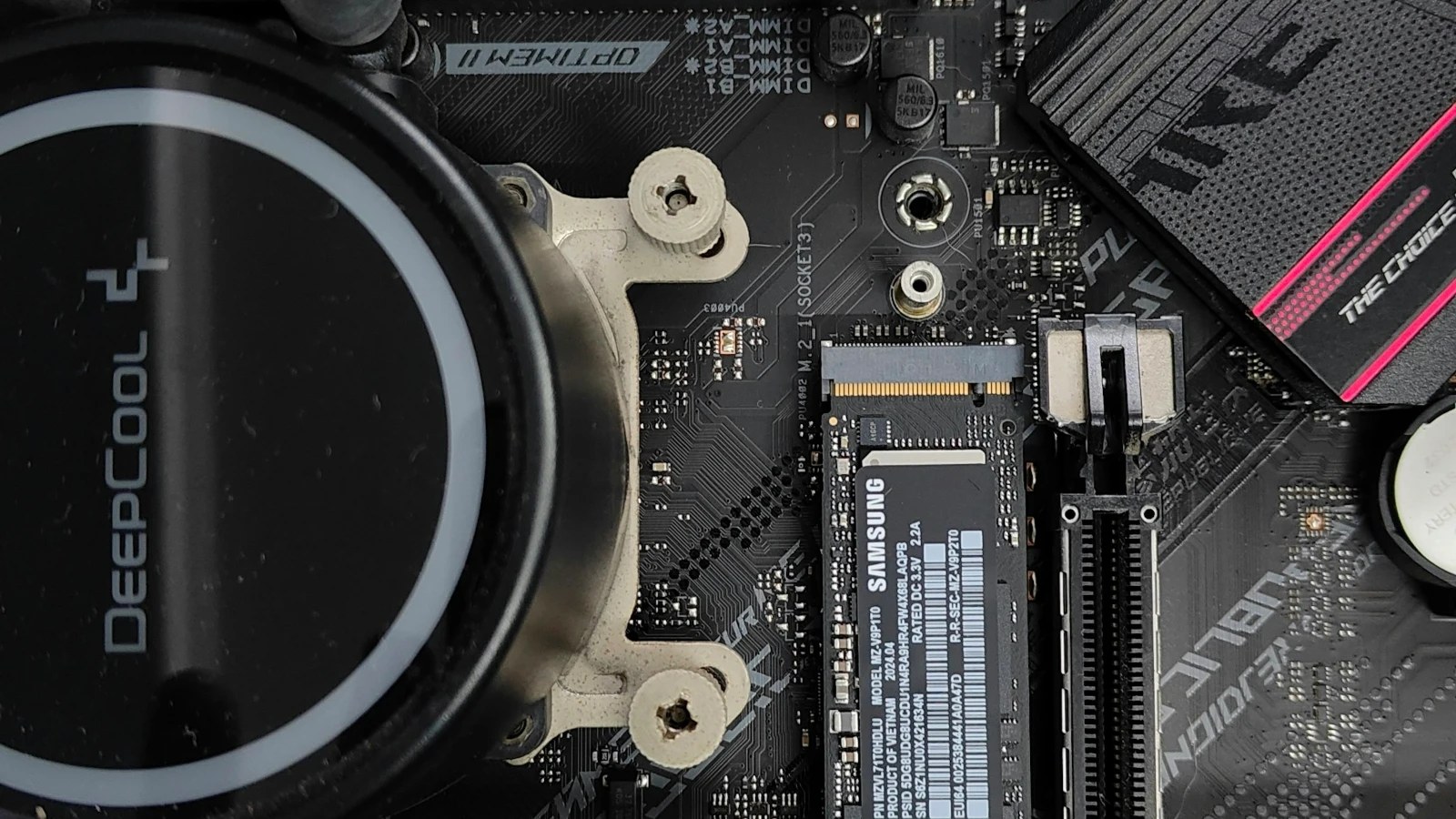 A motherboard with a liquid cooler and an M.2 SSD installed