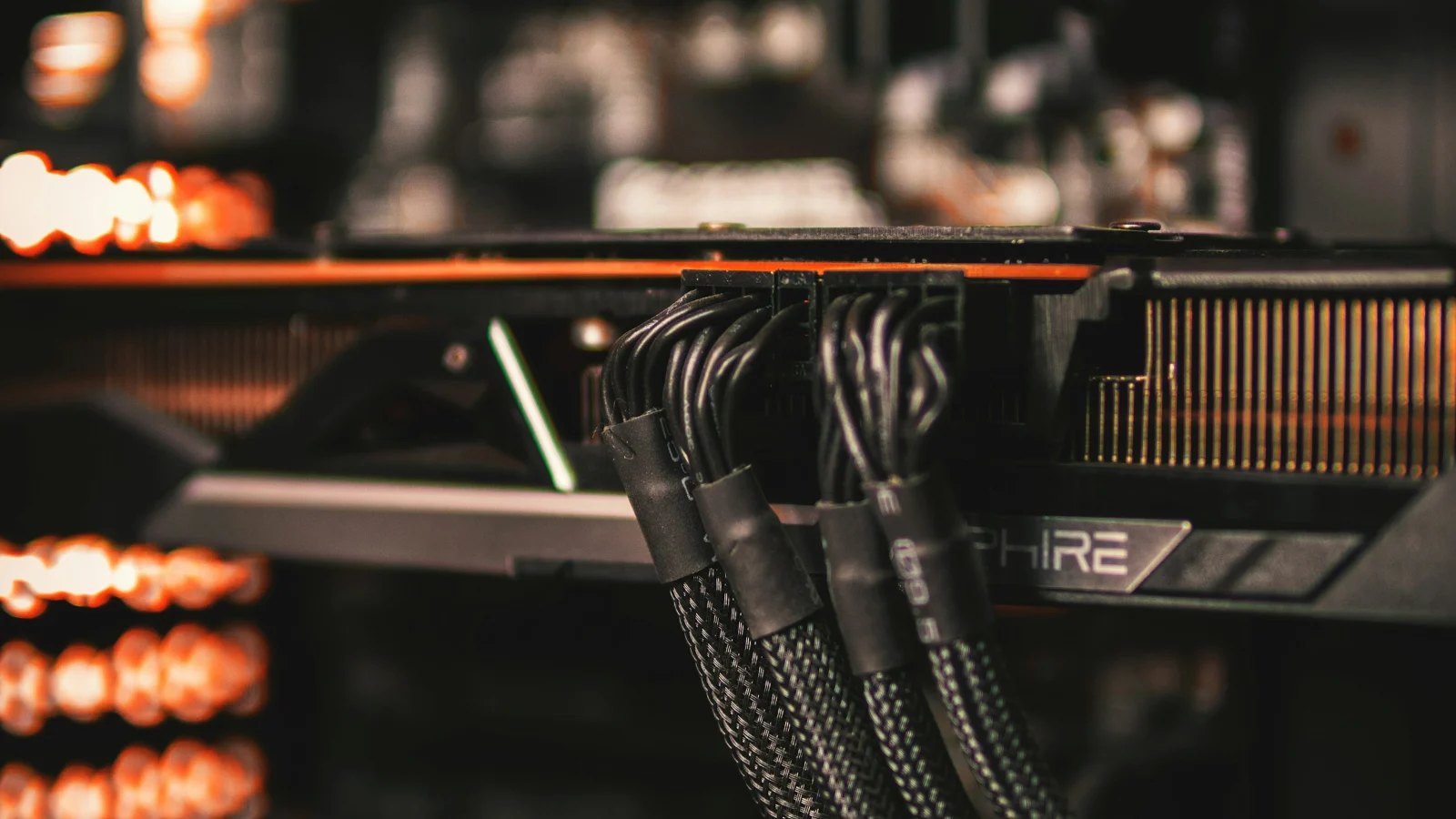 Power cables plugged into a graphics card inside a PC
