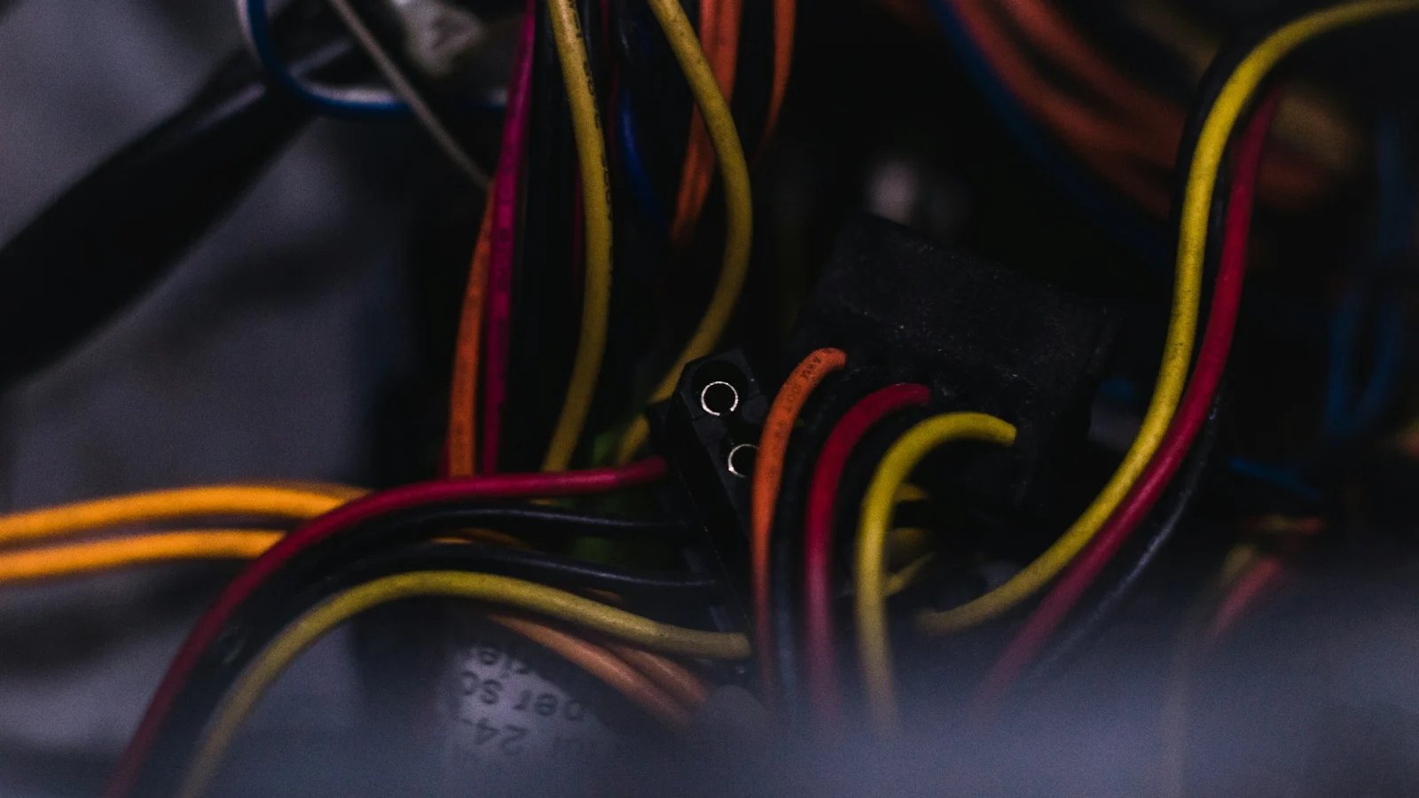Red, yellow and black power supply wires inside a computer