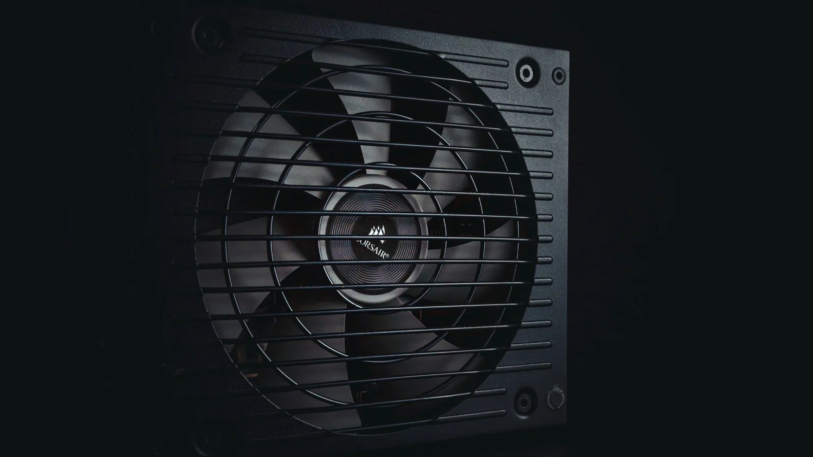 Close-up of a power supply fan grille in black and white