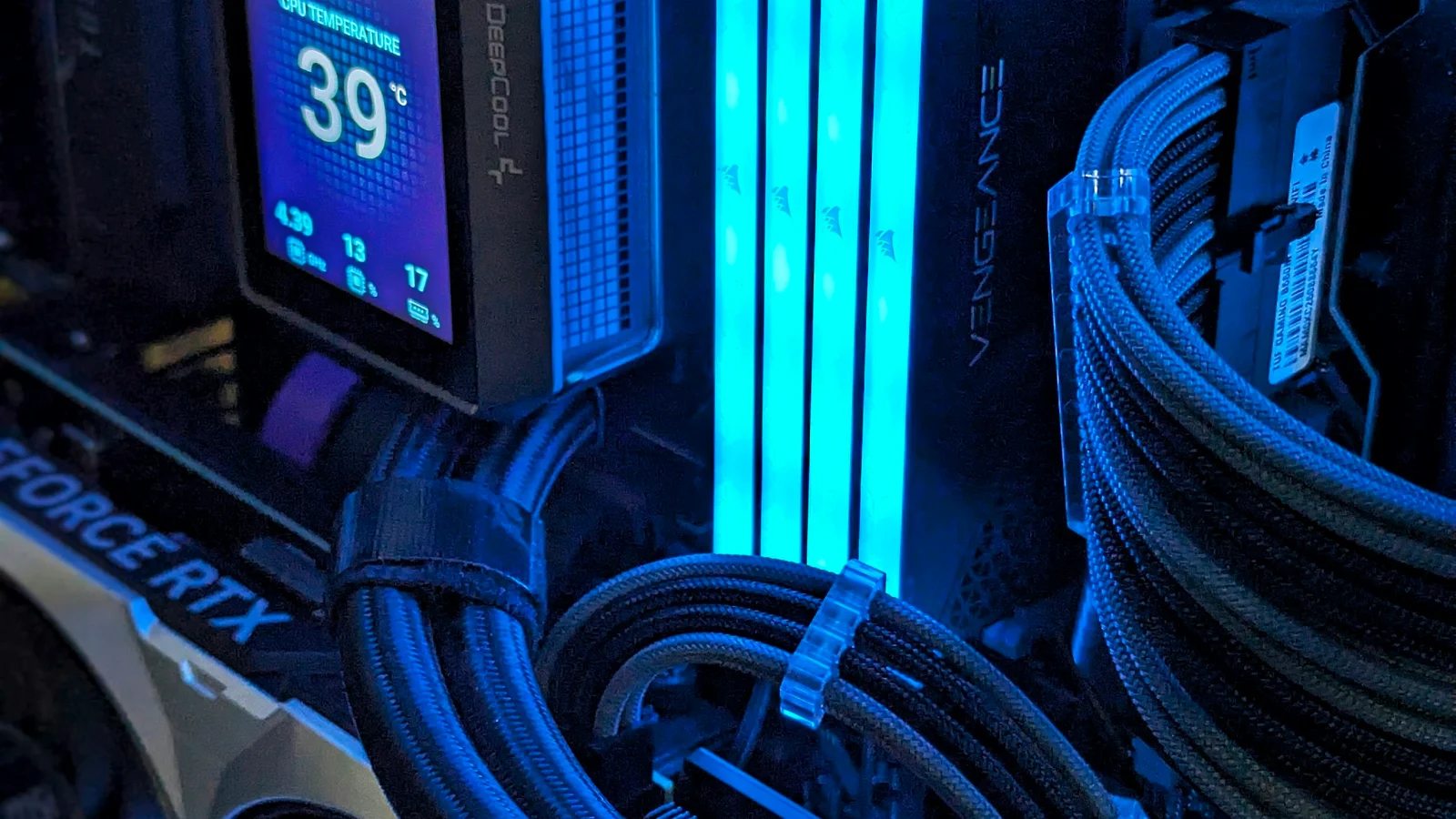 RGB RAM modules lit up inside a gaming PC
